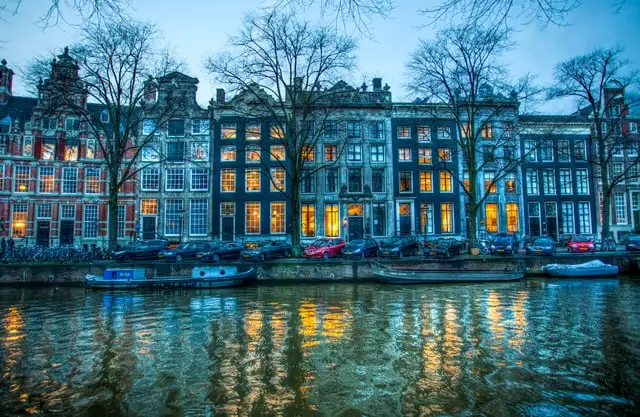 Anne Dirkse, CC BY-SA 4.0, via Wikimedia Commons Herengracht canal houses at blue hour