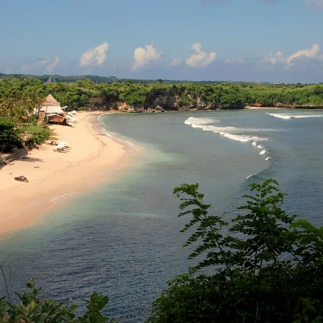 Balangan's long white beach and reef from the clifftop
