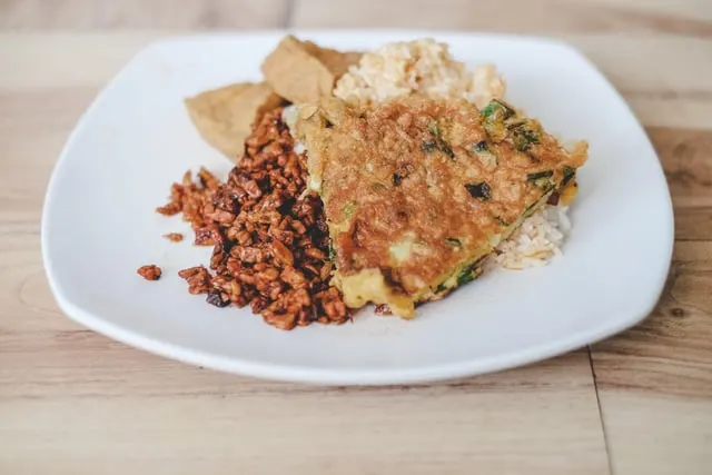Vegetarian nasi campur with tempeh, vegetables and rice