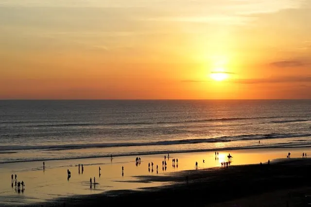 Sunset over the sea at Seminyak (people far off)