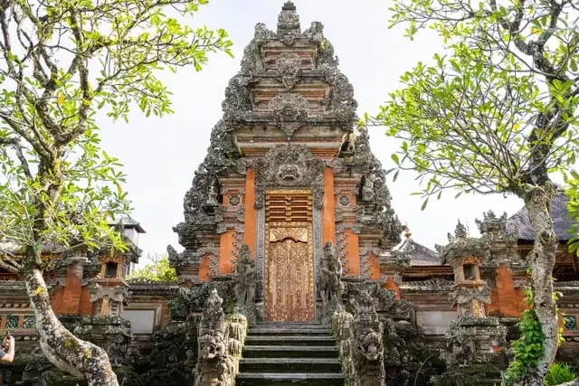 The carved red-brick gate of Pura Taman Saraswati, Ubud