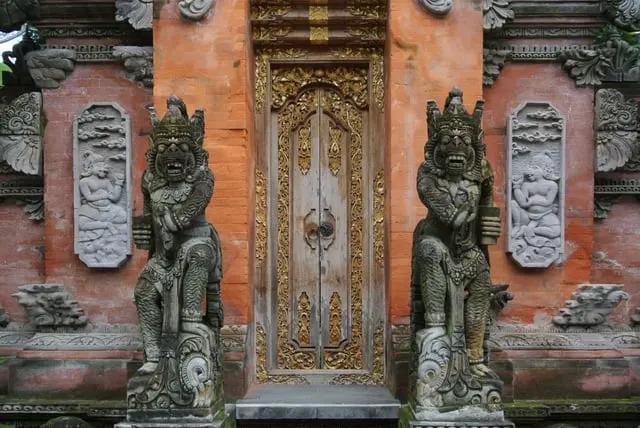 The carved gilded doorway and guardian statues of Ubud Palace
