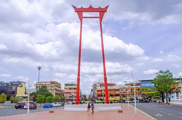 The red Giant Swing under a blue sky with white clouds
