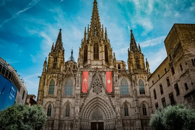 Barcelona Cathedral's Gothic façade, deep blue sky