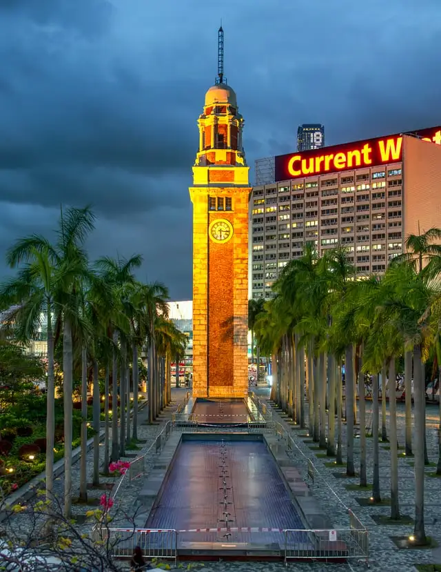 The Clock Tower among palms at Tsim Sha Tsui, early evening