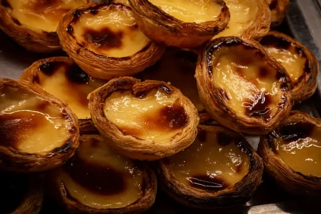 Golden-topped Portuguese-style egg tarts, close view