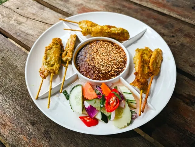 Chicken satay with peanut sauce and salad