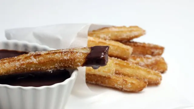 Churros dipped in chocolate