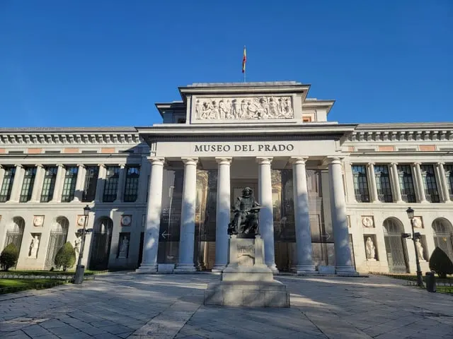 The Prado's Velázquez entrance and statue, blue sky