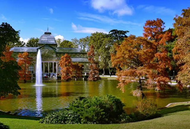 The Crystal Palace with autumn trees and its fountain, blue sky