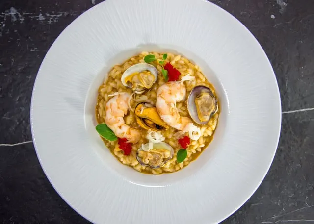 Saffron seafood rice with mussels and prawns (stand-in, not cavatelli)