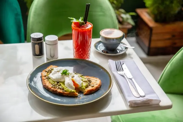 Poached eggs on toast at a café table (stand-in)