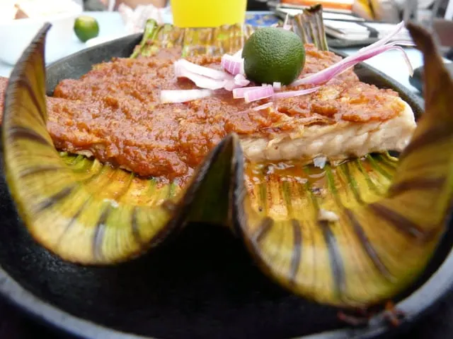Sambal stingray grilled on a banana leaf with lime