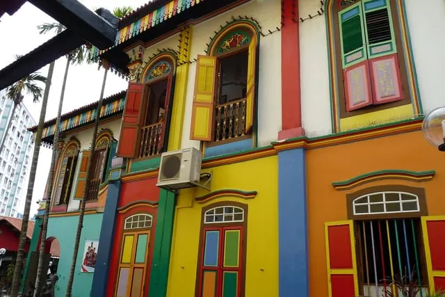 Tan Teng Niah's painted shutters in red, blue and yellow